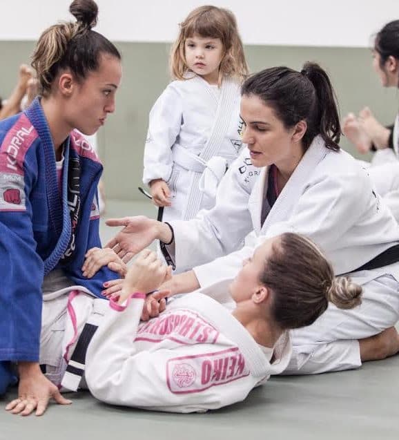 Hertz Oliveira / Graciemag; Kyra teaching at Alliance Sao Paulo Kyra Gracie demonstrating a jiu-jitsu position during instruction