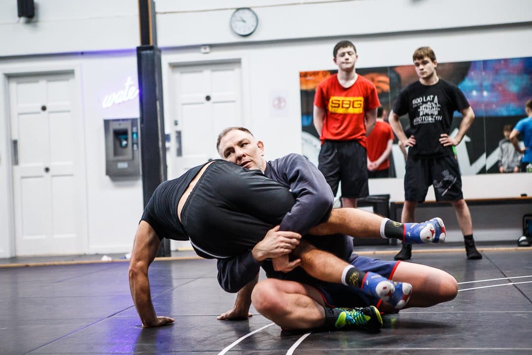 Two no-gi grapplers working in a ground position
