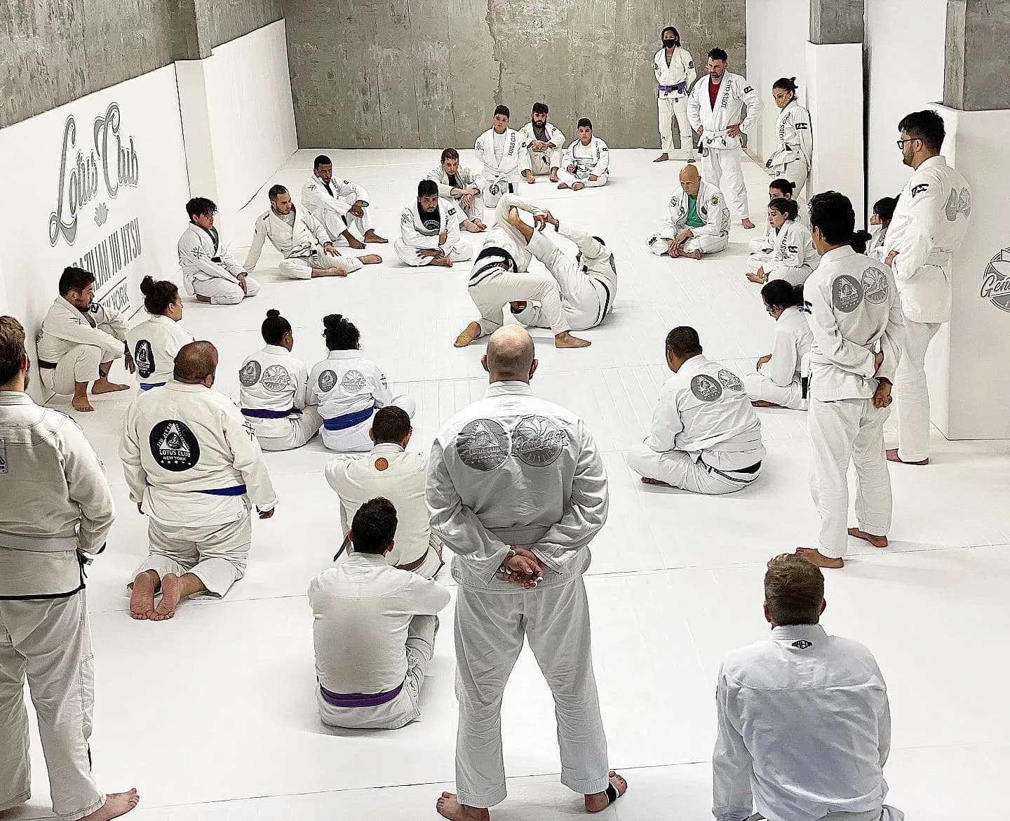 A training session at Gentle Art Studio - Lotus Club Brazilian Jiu Jitsu in Astoria, NY, with practitioners on the mats.