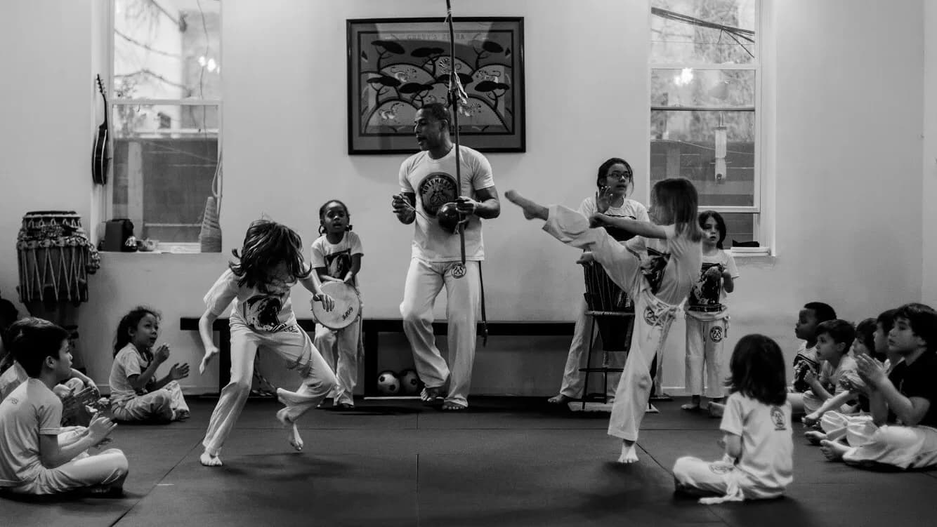 Children participating in a Capoeira class at Brooklyn Motumbaxé Capoeira Jiu Jitsu in Brooklyn, NY.