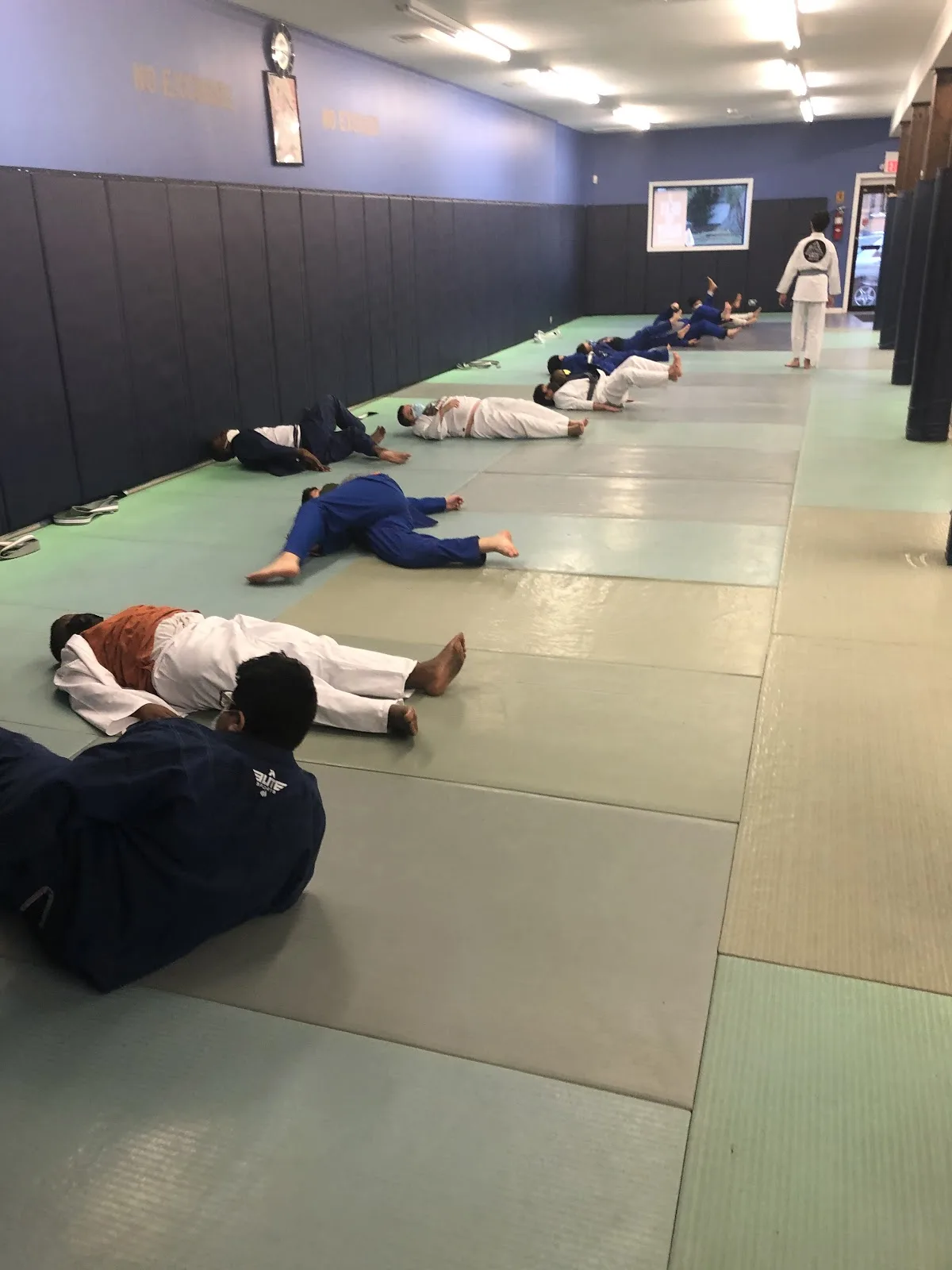 Elijah Brazilian Jiu Jitsu gym in Union, NJ, featuring students training on mats in various colored gis.