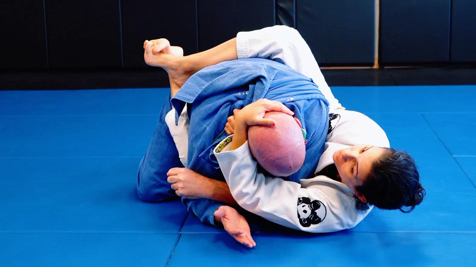 Korfhage Brazilian Jiu Jitsu / Caio Terra Academy Long Island in Lindenhurst, NY, featuring two practitioners on blue mats.